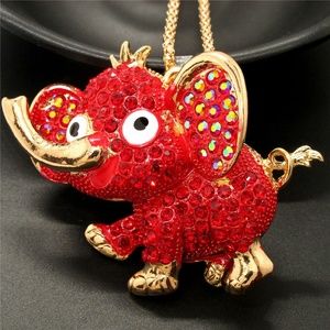 A ELEPHANT NECKLACE IN GOLD TONE WITH RED CRYSTALS